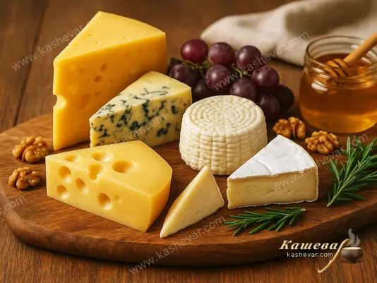 Different kinds of cheeses on a wooden board