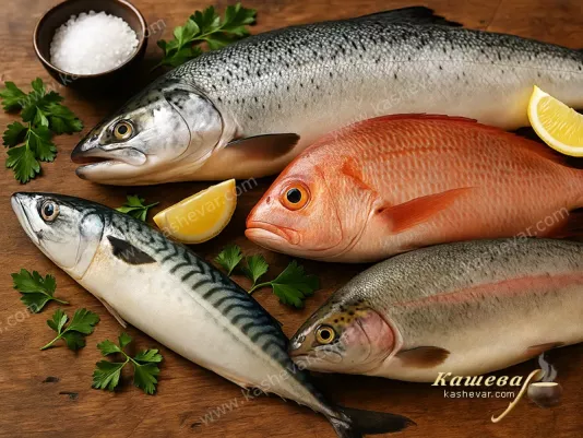 Fresh fish of different types on a kitchen table