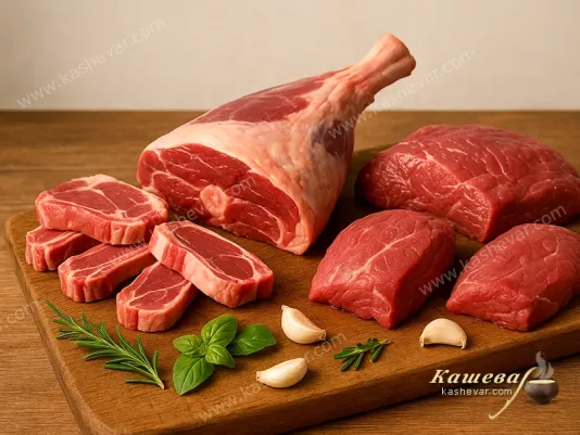 Fresh lamb and goat meat on a wooden board