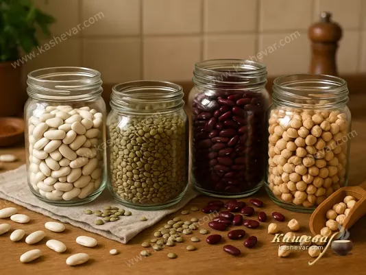 Different types of legumes in glass jars