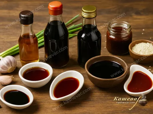 Various soy and Asian sauces in sauce dishes and jars
