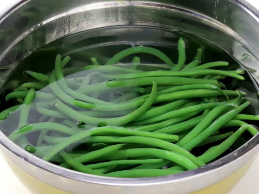 Prepare the green beans and peas
