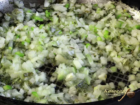 Onion finely chopped in a pan.