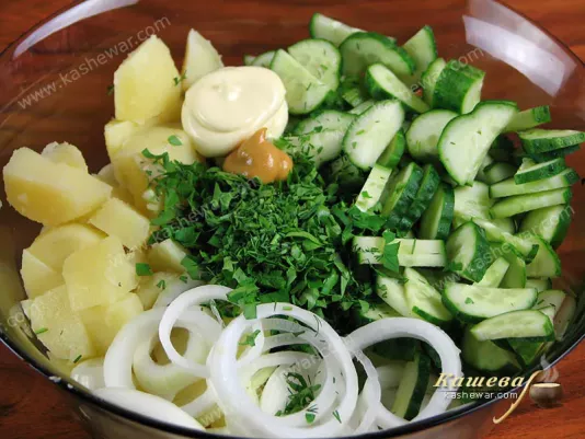 Mixing vegetables for salad