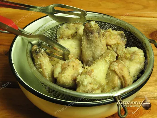 Removing excess fat from chicken wings