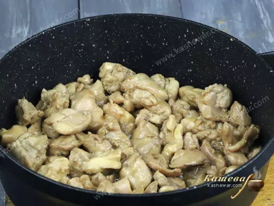Chicken pieces in a frying pan