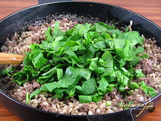 Next, add chopped spinach to the pan