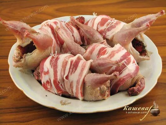 Quail in bacon