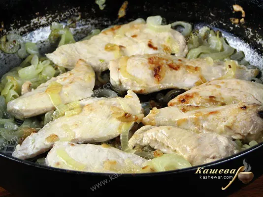 Fry the chicken in a pan with onions