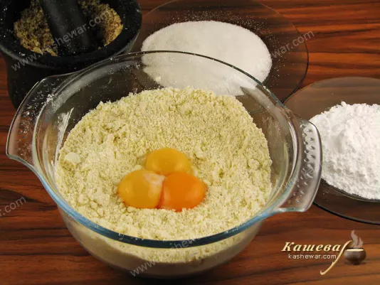 Add the yolks to the grated butter with flour