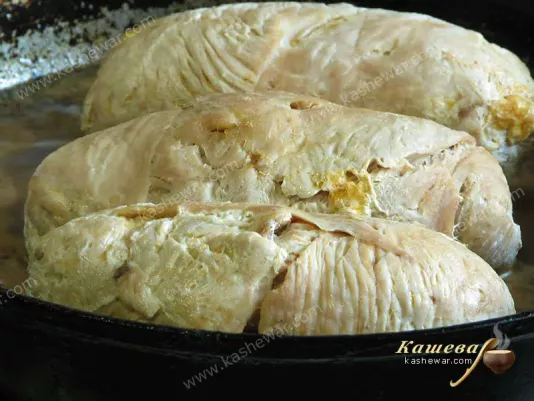 Turkey rolls in a pan with sauce