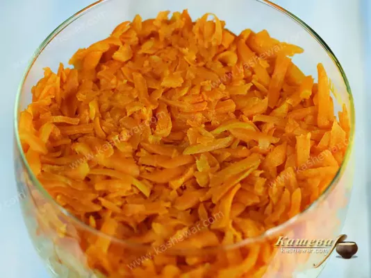 Boiled grated carrots in a glass