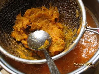 Grinding apricots through a sieve