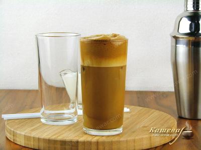 Adding milk and ice to frappe coffee