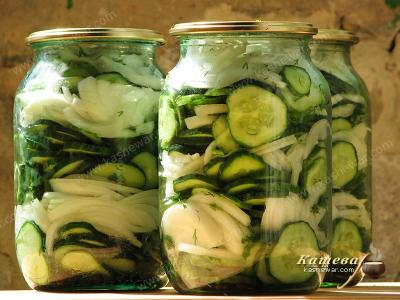 Putting ingredients of Nezhin salad in jars
