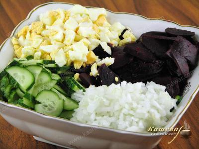 Mixing Beet and Cucumber Salad Ingredients