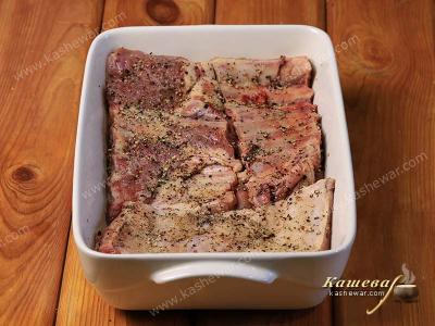 Pork ribs smeared with salt and pepper